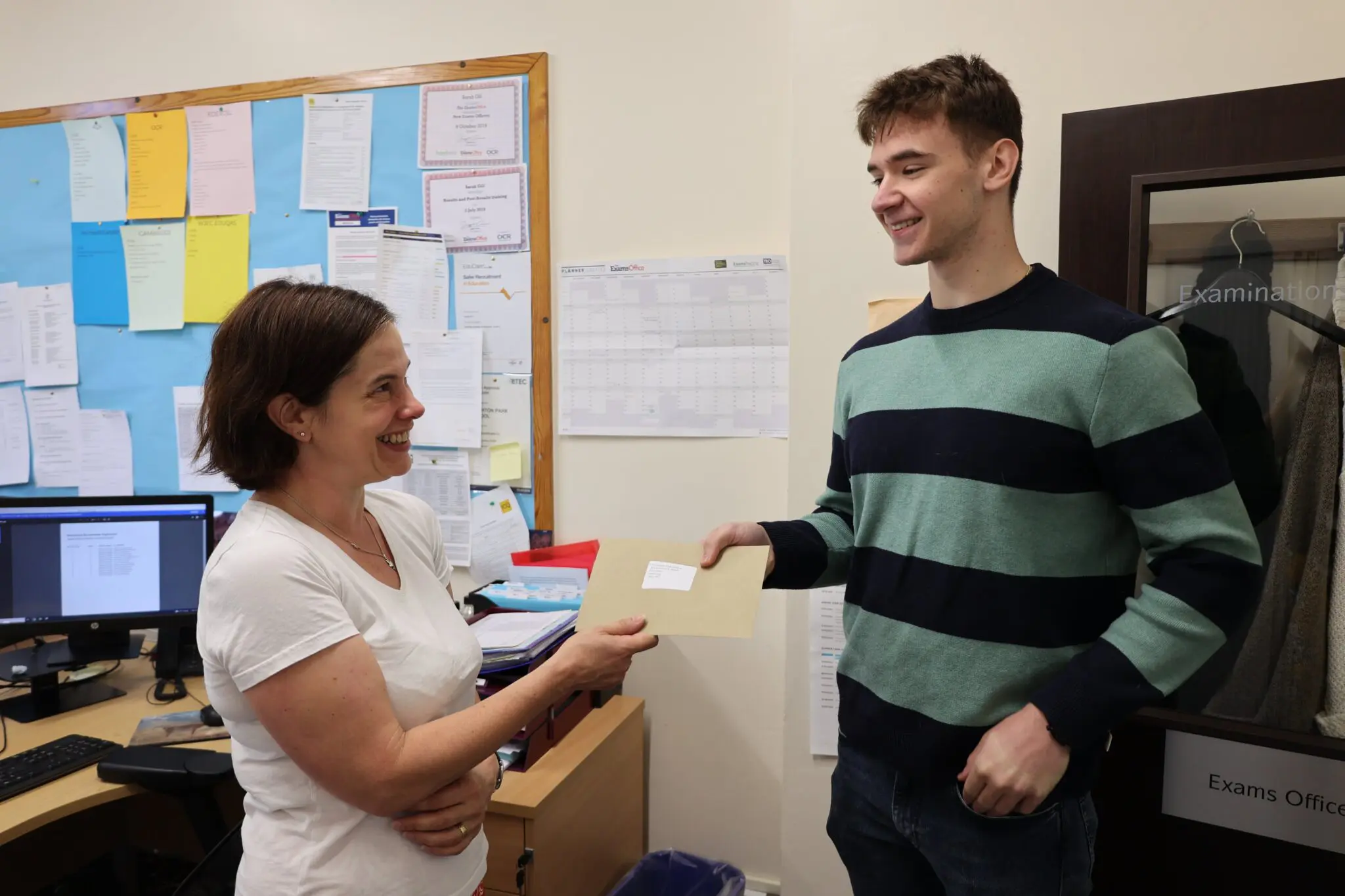 IB student being handed his results by Leighton Park teacher