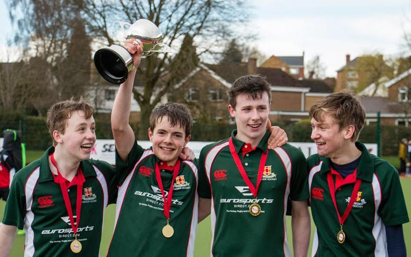sports team celebrating their victory for the Friends’ School Lisburn