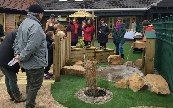 parents and children exploring the new EYFS playground at Bootham School