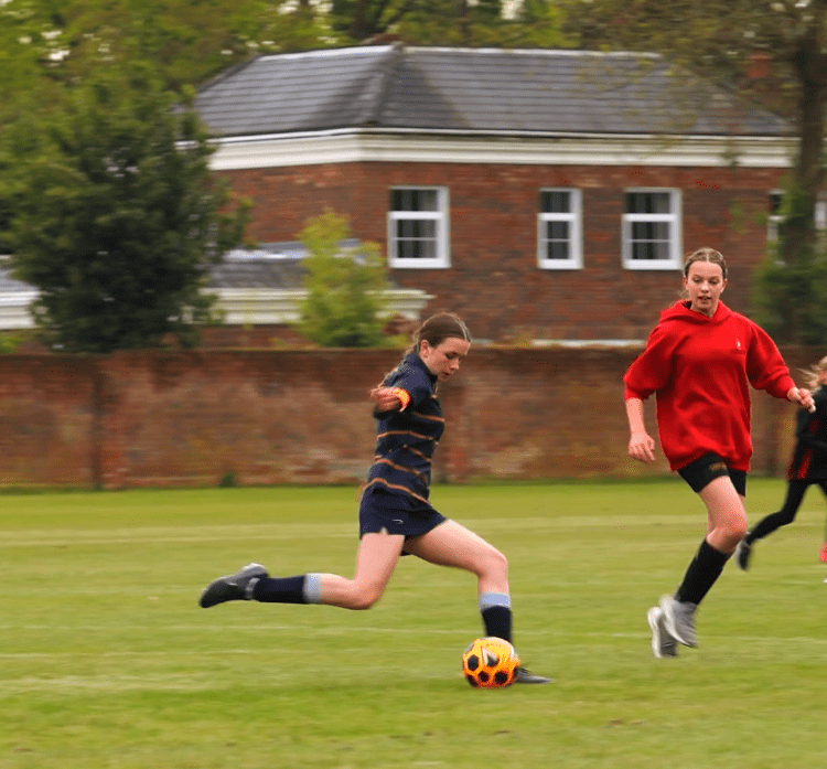 girls playing football