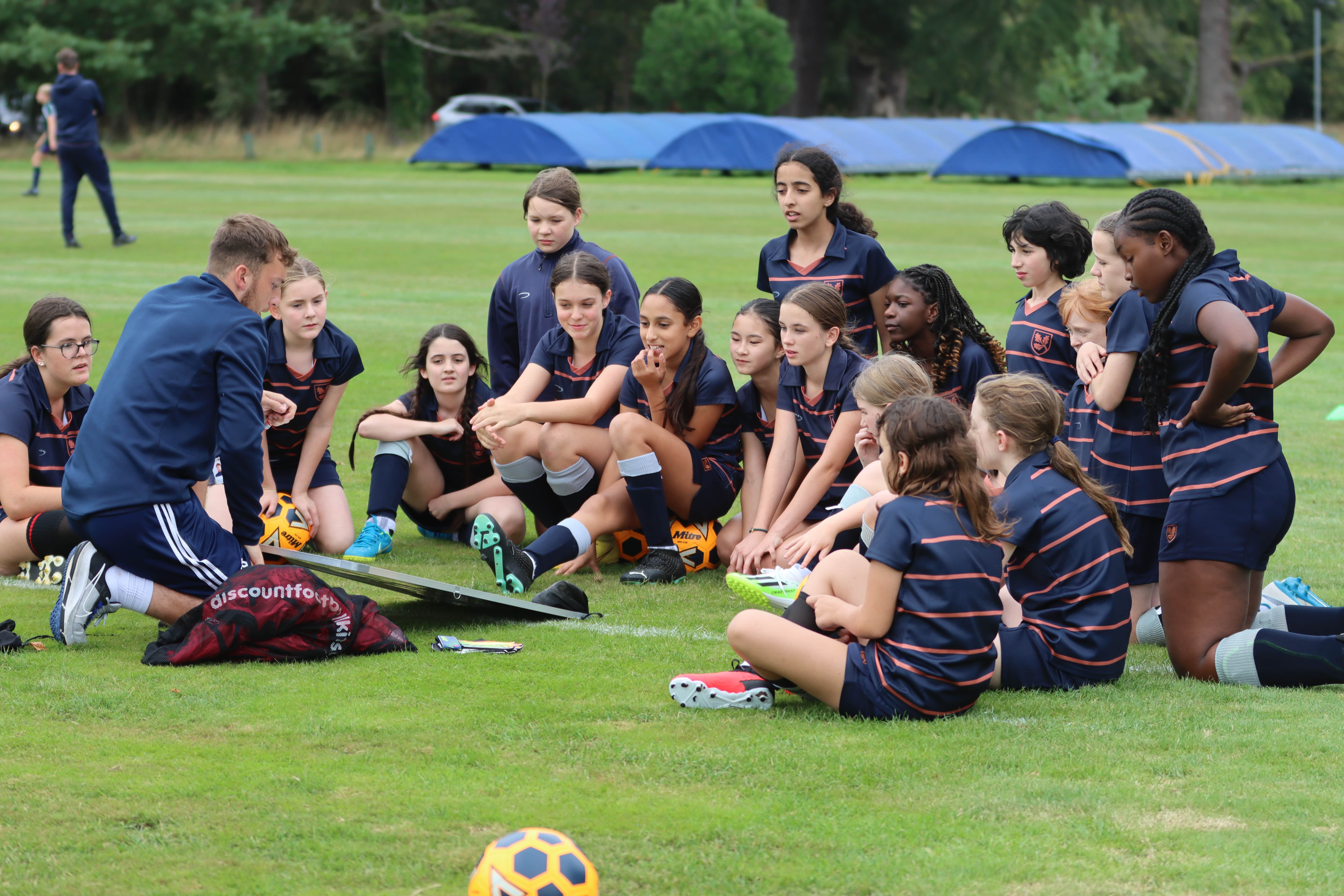 Her Game Too sports huddle on the pitch