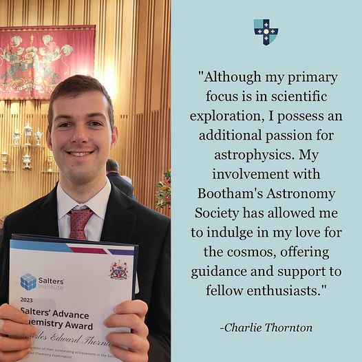 A level student holding Salters' Advanced Chemistry prize