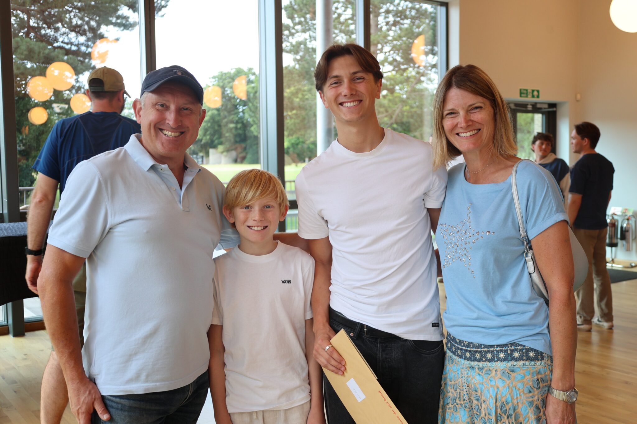 family smiling on 2024 a level results day