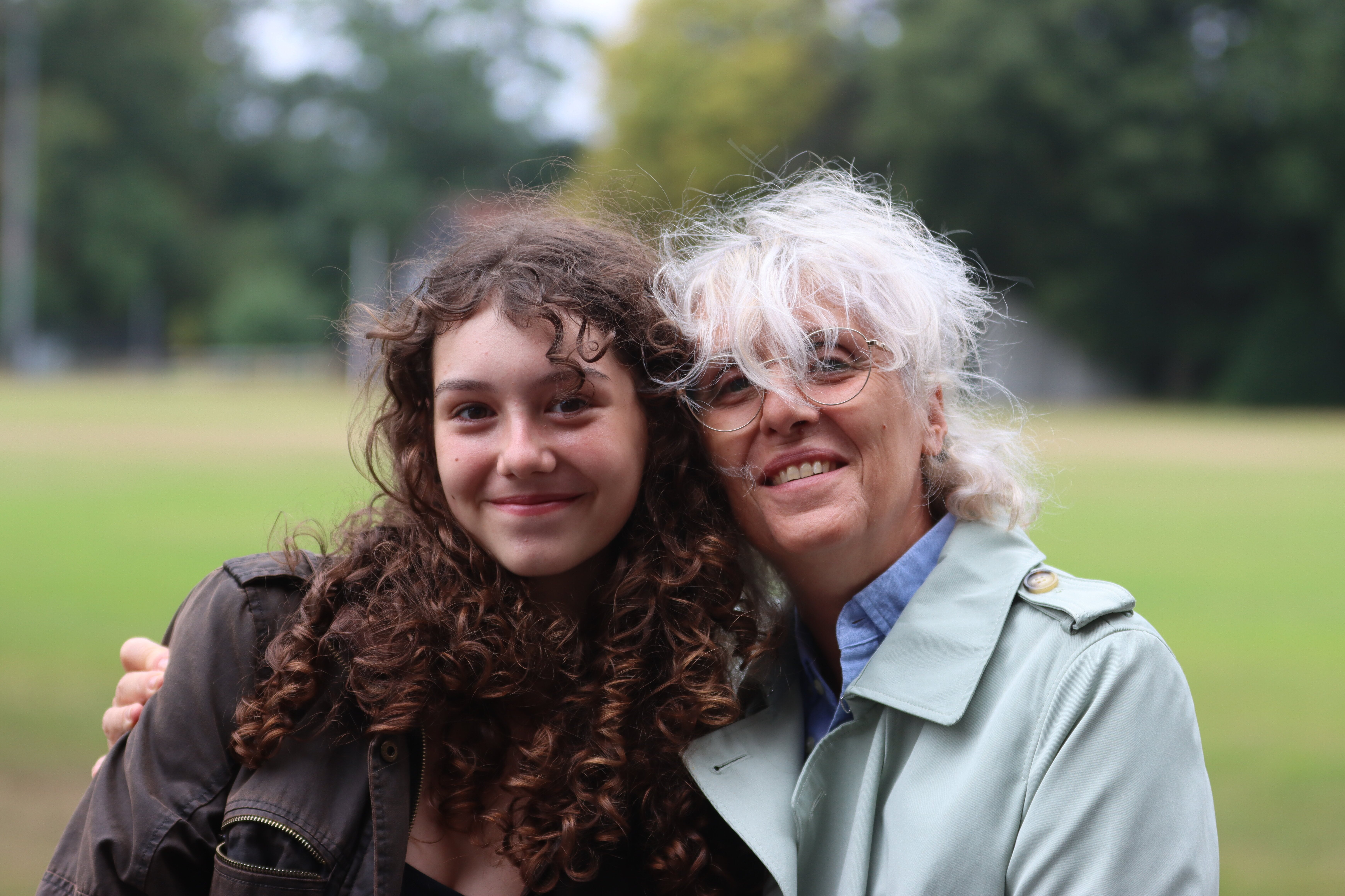 curly haired mother and daughter on GSCE results day