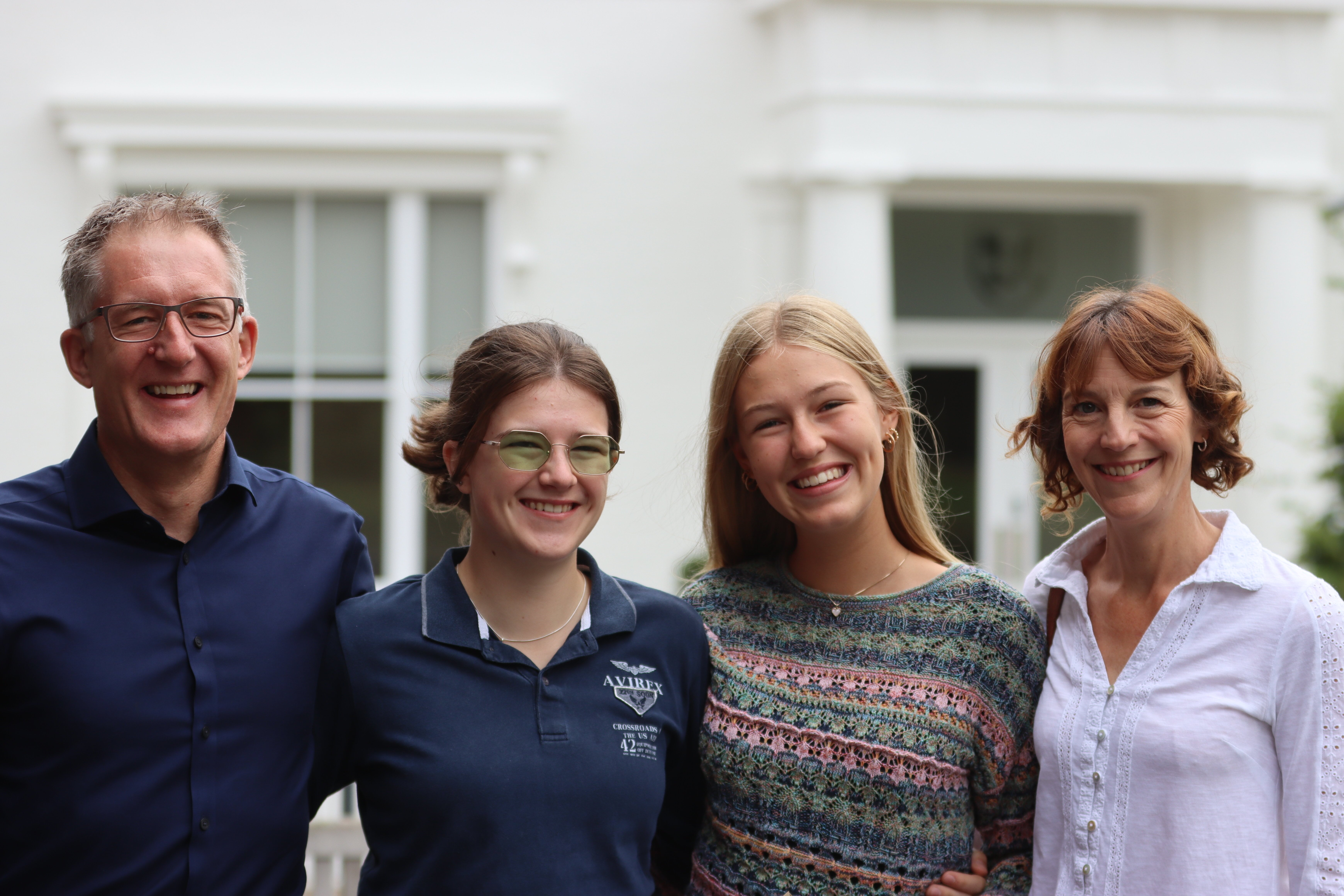 family smiling about 2024 GCSE results