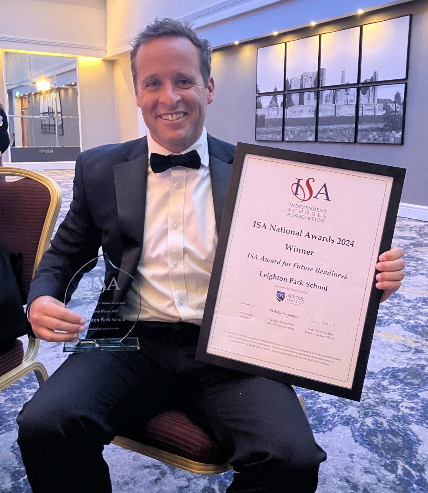 Leighton Park staff member holding ISA Future Ready Award