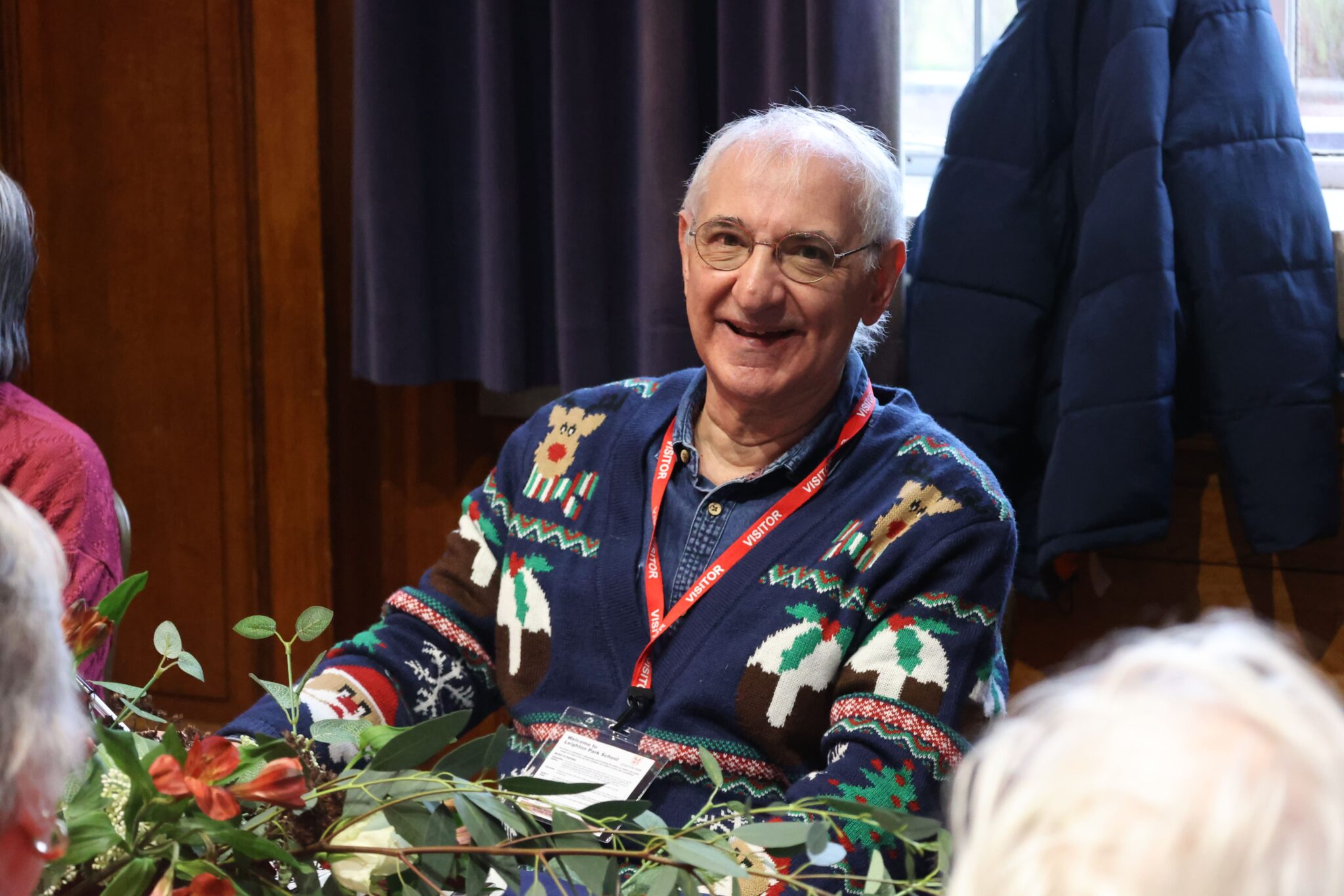 elderly man in a Christmas jumper