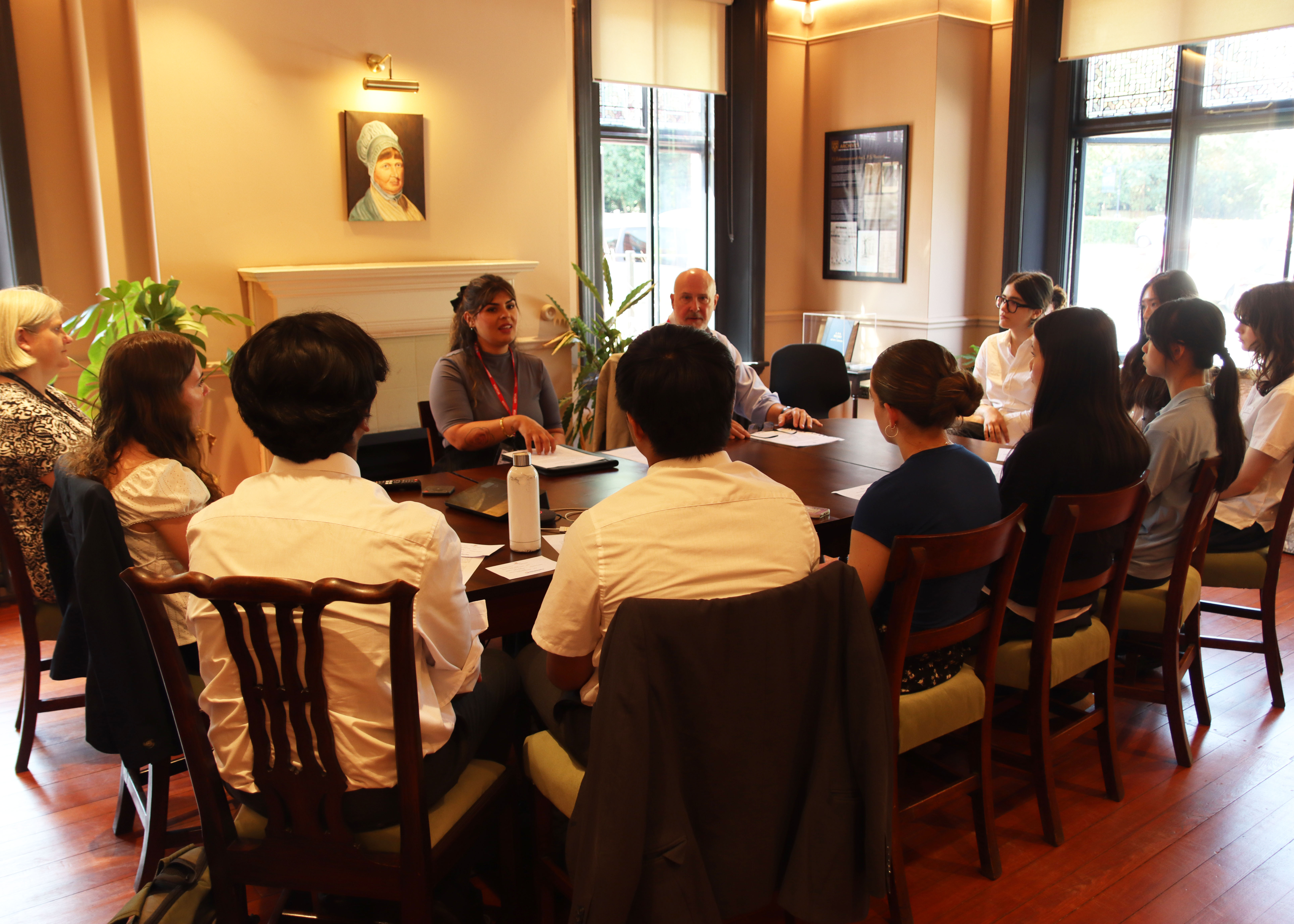 Business Ethics Schools Fair table meeting