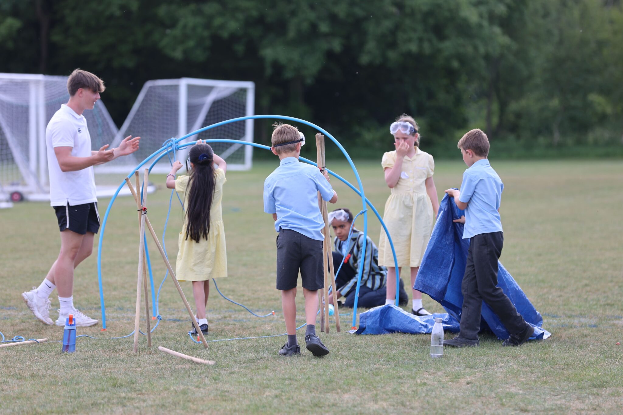 children making a temporary shelter