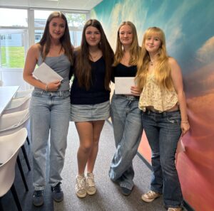 girls celebrating together on 2025 GCSE results day